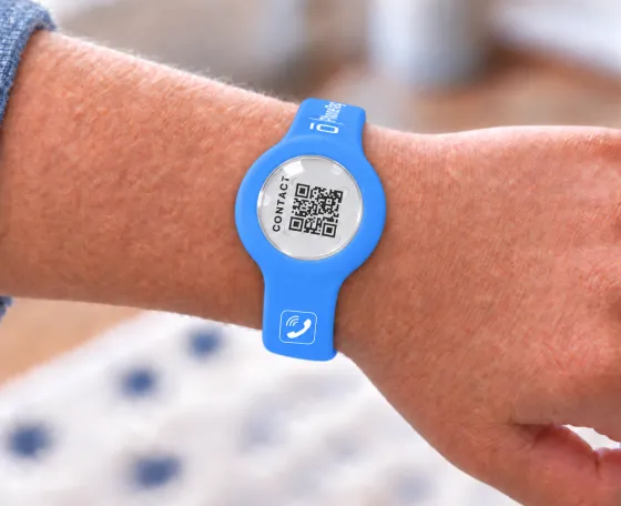 PhoneTag Smart Band in Blue on a child's wrist